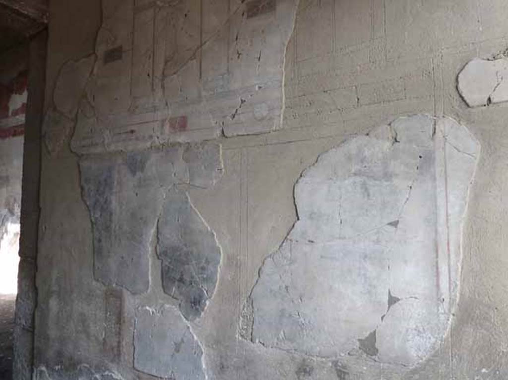 III.11 Herculaneum. May 2010. Room 1, painted decoration on north wall of entrance corridor, looking west.